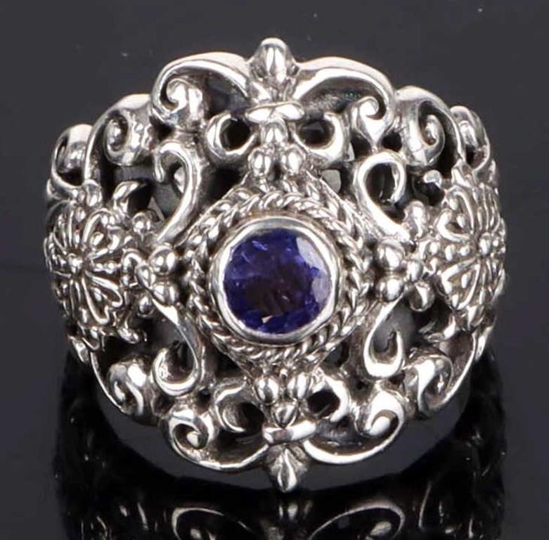 SARDA DESIGNER TANZANITE ORNATE STERLING RING: Sarda designer tanzanite ornate sterling silver ladies ring. Stone Type: Tanzanite Weight: 9.23 Grams Size: US 7 Condition: Some internal wear, see images.