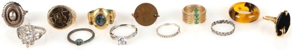 ASSORTED LADIES FASHION RINGS LOT OF 12: Assorted ladies fashion rings lot of 12. Three are sterling silver. other rings of note are one which has a 1977 1 cent coin from Trinidad and Tobago and another which has a 1988 5 cent Franc fixed on