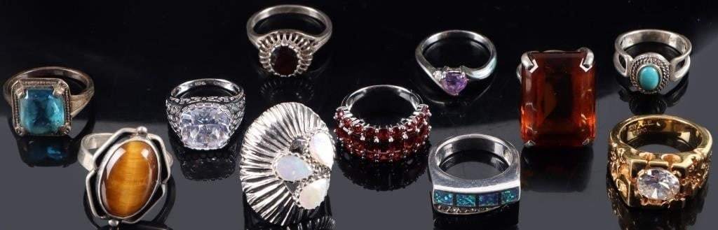 STERLING SILVER LADIES RINGS TIGERS EYE GARNET-11: Lot of eleven sterling silver ladies rings, to include one with a large bright rhinestone, one Brutalist gold-tone piece with a bright rhinestone, a piece with cut opal squares and bright rhinestones 