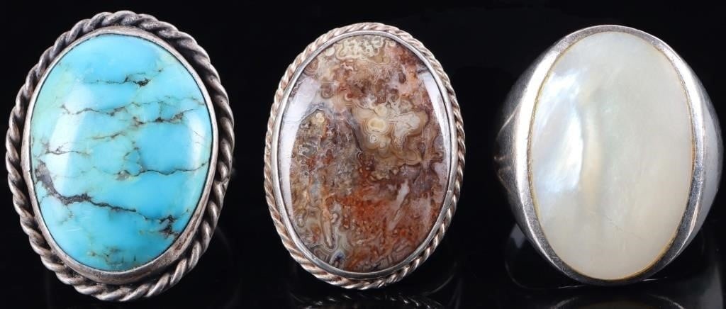 SW STYLE 925 LADIES RINGS MOP TURQUOISE AGATE (3): Southwest style sterling silver ladies rings, to include one with a large mother of pearl stone, one with a large turquoise stone, and one with a large agate stone. Stone Type: Assorted Weight: 25.76 