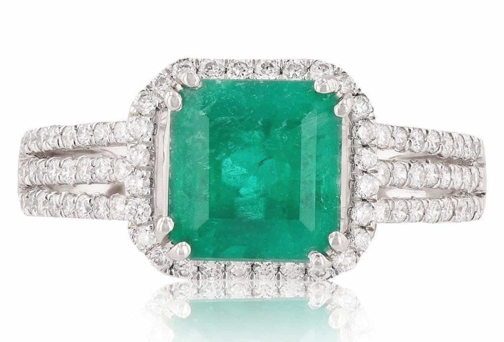1.59CT EMERALD PLATINUM LADIES RING W/ DIAMONDS: One electronically tested platinum ladies cast emerald and diamond ring with a bright polish finish. Condition is new, good workmanship. The featured emerald is set within a diamond bezel supported by