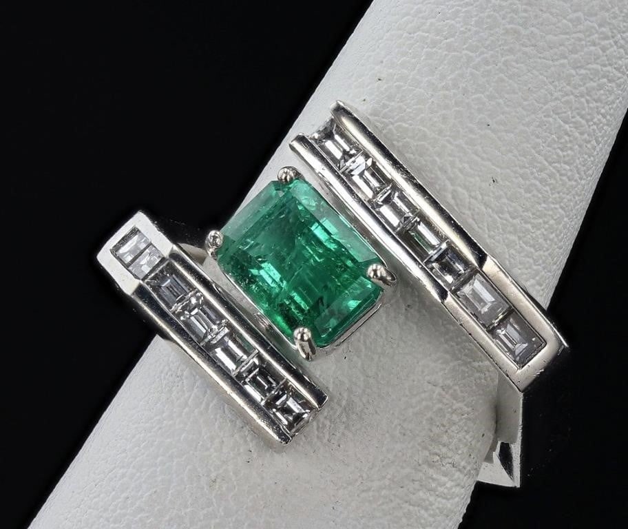 1.75 EMERALD PLATINUM LADIES RING W/ DIAMONDS NEW: One polished, stamped, and tested platinum ring marked Oscar Friedman. The ring is mounted with: 1 genuine emerald center stone weighing approximately 1.75 carat, and 14 genuine faceted diamonds weigh