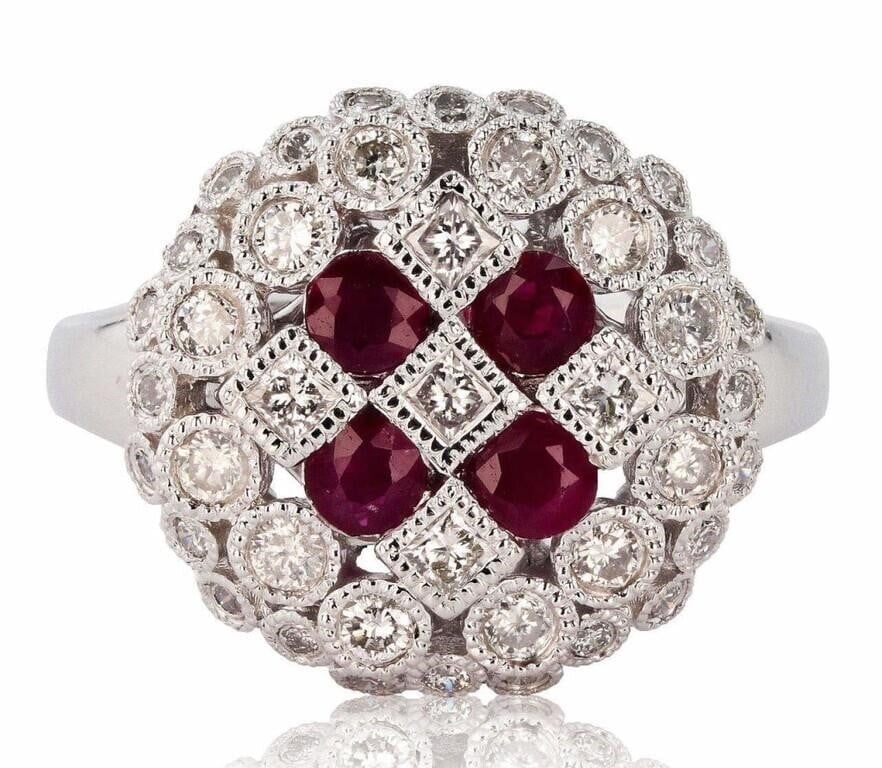 PLATINUM LADIES RING W/ DIAMONDS & RUBIES: ONE PLATINUM LADY'S CUSTOM MADE DIAMOND & RUBY RING . 8.20 GR TW #1 - MAIN CENTER GEMSTONE(S) :# IDENTITY : ALL DIAMONDS SET IN BEZEL SETTING STYLE; CARAT WEIGHT : 0.70 CT; SHAPE & MEASUREMEMT : ROUND