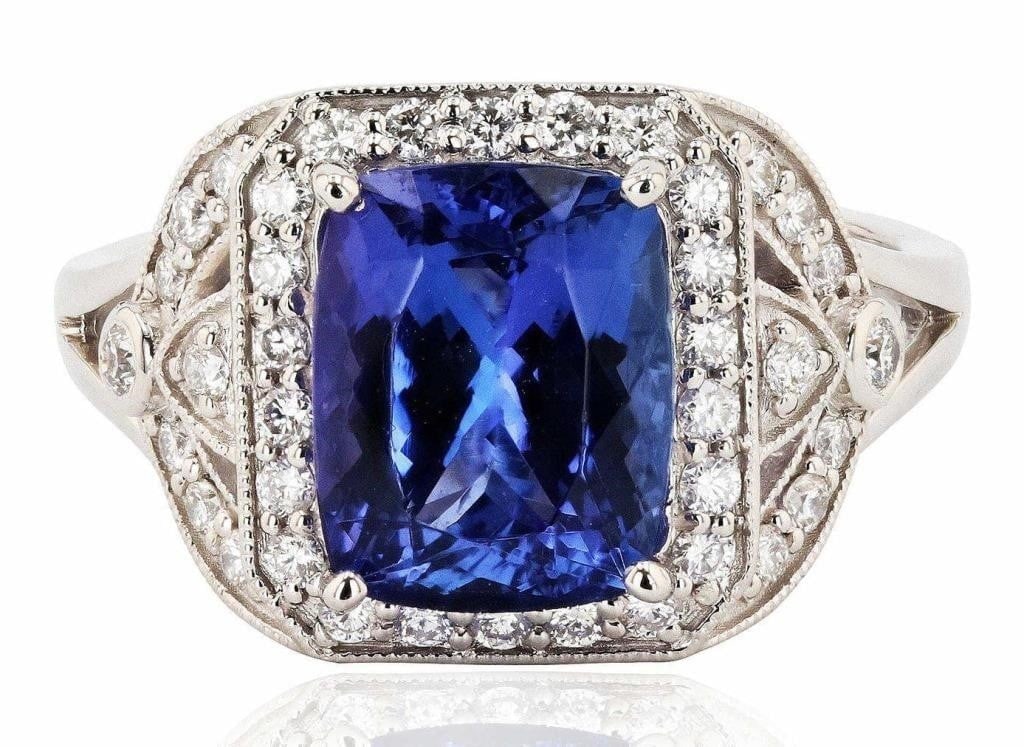 PLATINUM LADIES RING W/ DIAMOND & TANZANITE NEW: One polished, stamped, and tested platinum ring with a bright finish. The ring is mounted with: 1 genuine tanzanite center stone weighing approximately 3.43 carat, and 38 genuine round diamonds weighi