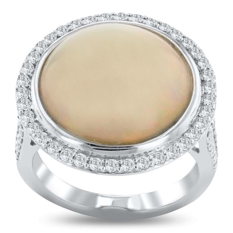 PLATINUM LADIES RING W/ DIAMONDS & OPAL W/ GIA: One electronically tested platinum ladies cast opal and diamond ring with a bright polish finish. ;The featured opal is set within a diamond bezel supported by diamond set split shoulders, completed b