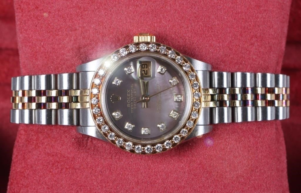 ROLEX OYSTER PERPETUAL DATEJUST LADIES WRISTWATCH: Rolex Oyster Perpetual Datejust ladies wristwatch w/ diamond accents. Gemstones to include forty-two 0.02ct round cut diamonds. This watch includes a black mop dial, yellow gold and stainless steel ba