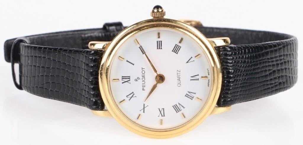 PEUGEOT QUARTZ BLACK LEATHER GOLD PLATED WATCH: Peugeot Quartz black leather gold plated ladies wristwatch includes a white dial and stainless steel back. Gold plated Wristwatch Peugeot Ladies Weight: 13.04 Grams Size: 24mm Condition: Very fine.