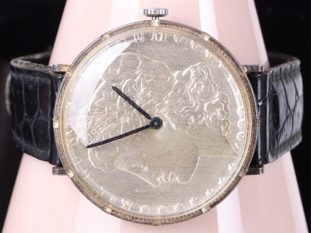 GENUINE 1900 MORGAN SILVER DOLLAR WATCH: Genuine 1900 Morgan Silver Dollar Watch. The iconic profile of Lady liberty serves as the backdrop, offering a level of detail and chracter that modern watched cannot replicate. The hour markers are e