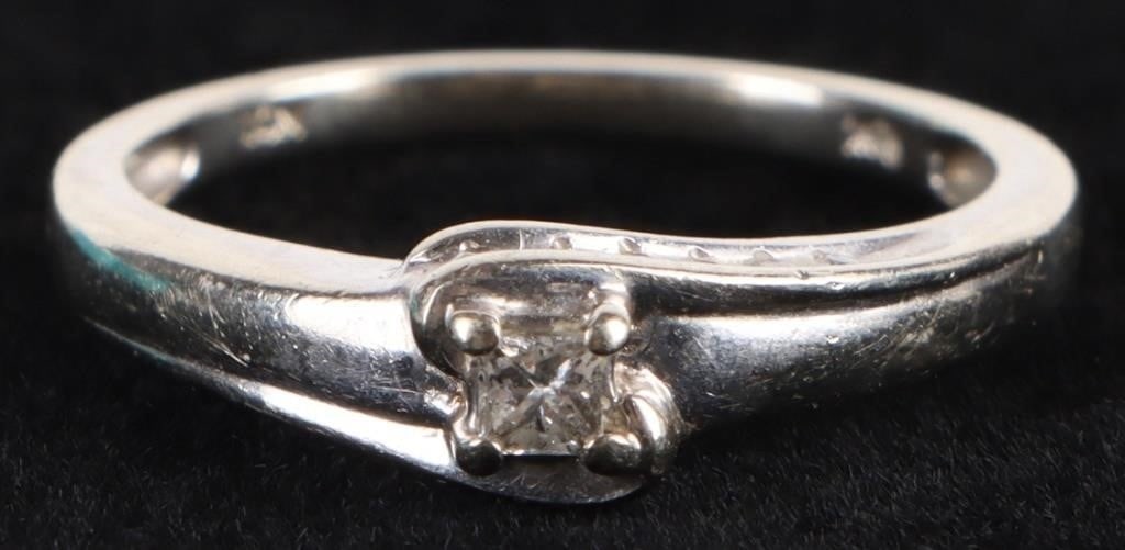 DAINTY 10K WHITE GOLD DIAMOND LADIES RING: Dainty 10K white gold diamond ladies ring with one 0.02CT princess-cut diamond and six 0.01CT round diamonds . Stone Type: Diamond Weight: 2.58 Grams Size: US 6.5 Condition: Very fine.