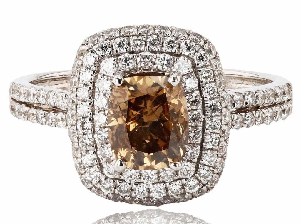 2.11CTW DIAMONDS 18K WHITE GOLD LADIES RING NEW: One electronically tested 18KT white gold ladies cast diamond ring with a bright polish finish. Condition is new, good workmanship. The featured diamond is set within tiered diamond bezels supported b