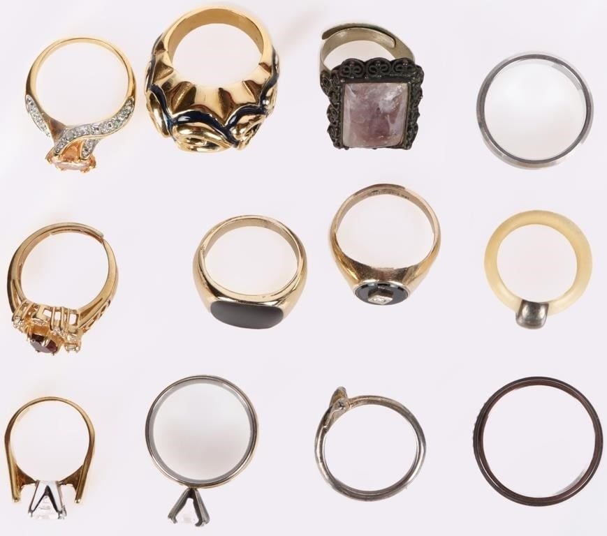 LADIES RINGS GARNET AMETHYST BONE SPINEL (12): Assorted lot of ladies rings. of note are an antique ring with a 7CT amethyst gemstone, a gold-toned ring with a large diamond-shaped white spinel, a plain gold ring, an ornate gold-toned ring with a 