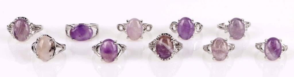 PURPLE NATURAL AMETHYST LADIES SILVER-TONE RINGS: Purple-pink natural amethyst ladies silver-tone rings - lot of 10. Stone Type: Amethyst Weight: 36.92 Grams Size: Varied Condition: Very fine.