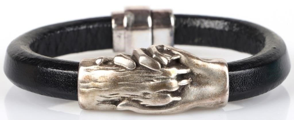 PAW-IN-HAND SILVER-PLATED LEATHER UNSEX BRACELET: Paw-in-hand silver-plated leather unisex bracelet. Size: 8.0" length Condition: Very fine.
