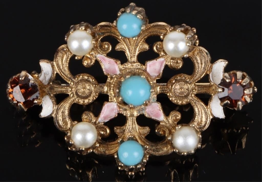 ANTIQUE LADIES BROOCH: Antique ladies brooch with two orange gems and seven pearl-like embellishments with paint in the background. Weight: 4.21 grams Size: 1.25" long Condition: Very fine.