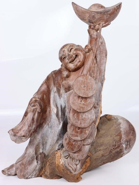 HAND-CARVED WOOD LAUGHING BUDDHA STATUE: Hand carved Buddha statue. Statue is carved out of a raw piece of wood. Live edge on back of statue and at bottom. Size: 17" x 13" Condition: See pictures.