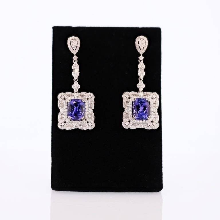 4.69CTW DIAMOND14K WHITE GOLD EARRINGS W/ TANZ: Fourteen karat (14K) white gold natural tanzanite zoisite and diamond earrings. Two (2) cushion brilliant cut natural tanzanite zoisite gemstones are mounted in the center of the earrings. Baguette an