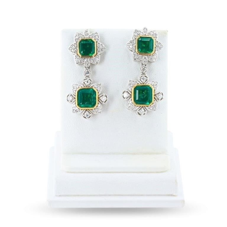 7.37CTW EM PLAT & 18K YELLOW GOLD EARRINGS W/ DIA: One electronically tested pair of platinum & 18K yellow gold earrings marked Oscar Friedman. The earrings are mounted with: 4 genuine emerald center stones weighing approximately 7.37 carats, and 130 