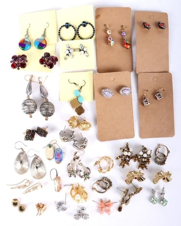 ASSORTED LADIES EARRINGS LARGE LOT OF 31: Large assortment of ladies earrings Items of note include a pair of square sterling silver earrings with multiple colored stones embedded throughout, a sterling silver pair of earrings in the shape of