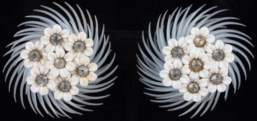 ANTIQUE LADIES CLIP-ON EARRINGS: Antique pair of ladies clip-on earrings. Each possesses seven flowers, each with a white gem in the middle, against a baby-blue plastic whorl. Weight: 7.54 grams Size: 2.5" diameter Condition: Very fi