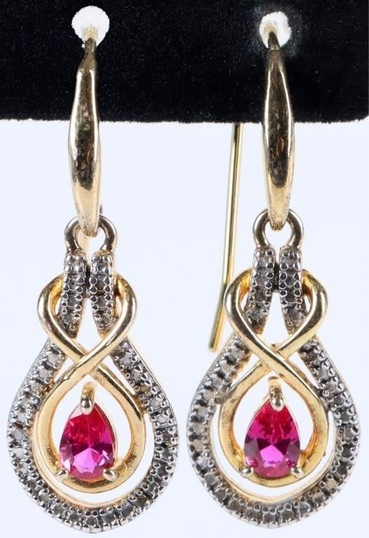 GOLD TONE STERLING SILVER LADIES EARRINGS W/ SAPPH: Gold-tone sterling silver ladies earrings with pink sapphire center stones. Stone Type: Sapphire Weight: 5.26 grams Size: 1.5" long Condition: Very fine.