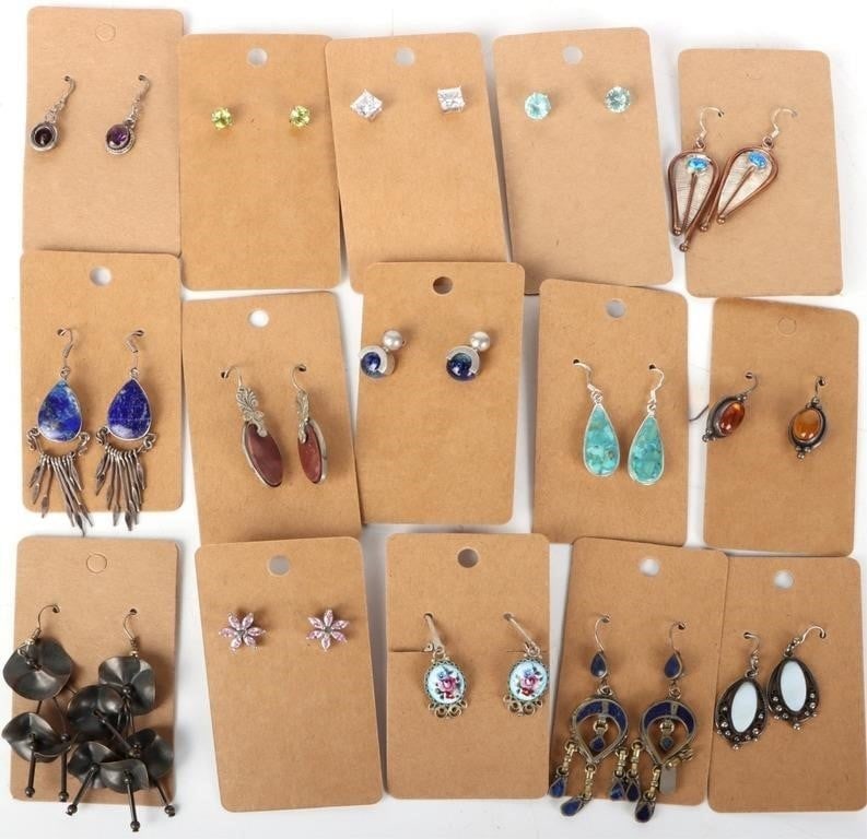FASHION EARRING SET COLLETION (15 TOTAL): Fashion Earring Set Collection (15 total). To include CZ Stud earrings, flower design earrings, dangle earrings, and more. Earrings come in original packaging. Condition: New. Please refer to images.