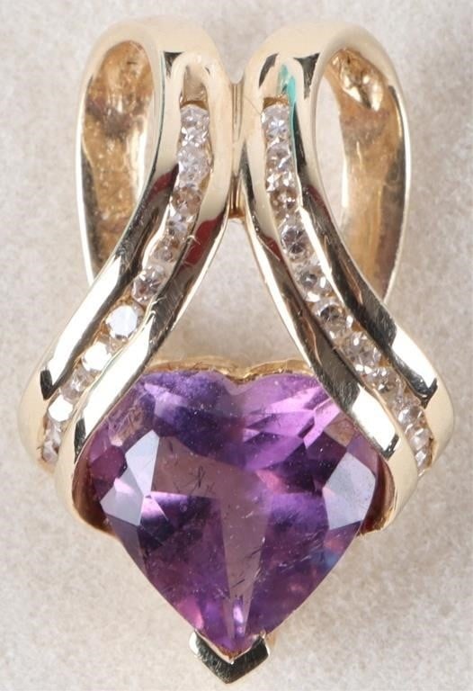 .22CTW 10K YELLOW GOLD LADIES PENDANT W/ DIAMOND: 10k yellow gold ladies pendant with a large heart-cut amethyst center gemstone and twenty-two 0.01ct round-cut diamonds on the gold, eleven on either side (.22ctw). Stone Type: Diamond Weight: 3.16 gr