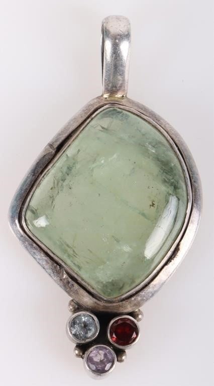 0.925 SILVER AMETHYST TOPAZ QUARTZ LADIES PENDANT: Sterling silver amethyst topaz garnet quartz ladies pendant. Gemstones to include one 0.20ct round cut amethyst, one 0.20ct round cut topaz, and one 0.20ct round cut garnet, and one 23.39 X 20.00mm gr