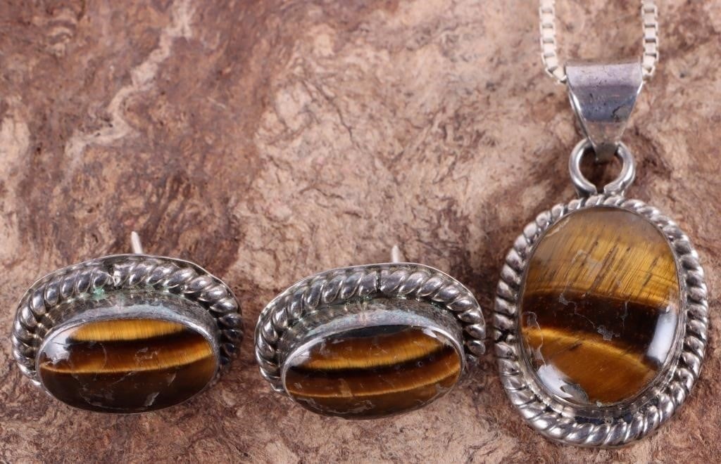 STERLING SILVER TIGERS EYE EARRINGS NECKLACE SET-2: Matching set of two pieces of sterling silver ladies jewelry, both of which feature large polished tigers eye stones. To include one pair of earrings and one necklace with pendant. Stone Type: Tigers 