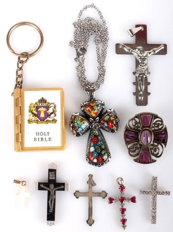 COLLECTION OF CATHOLIC CROSSES MINI BIBLE JEWELRY: Collection of Catholic crosses and mini bible ladies jewelry to include one New Testament key chain, one Murano glass necklace, one purple stone pendant, and five additional crosses. Size: 20" length 