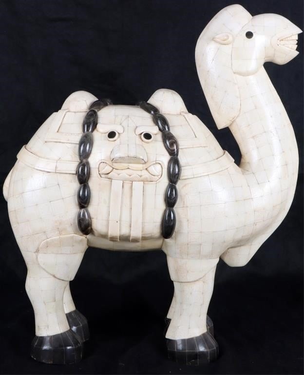 HANDMADE ORIGINAL CHINESE BONE CAMEL STATUE: Handmade original Chinese bone camel statue. This beautiful work of art has been hand-made and carved from white bone and has added carved dark horn details. The sides of the camel depict traditional 