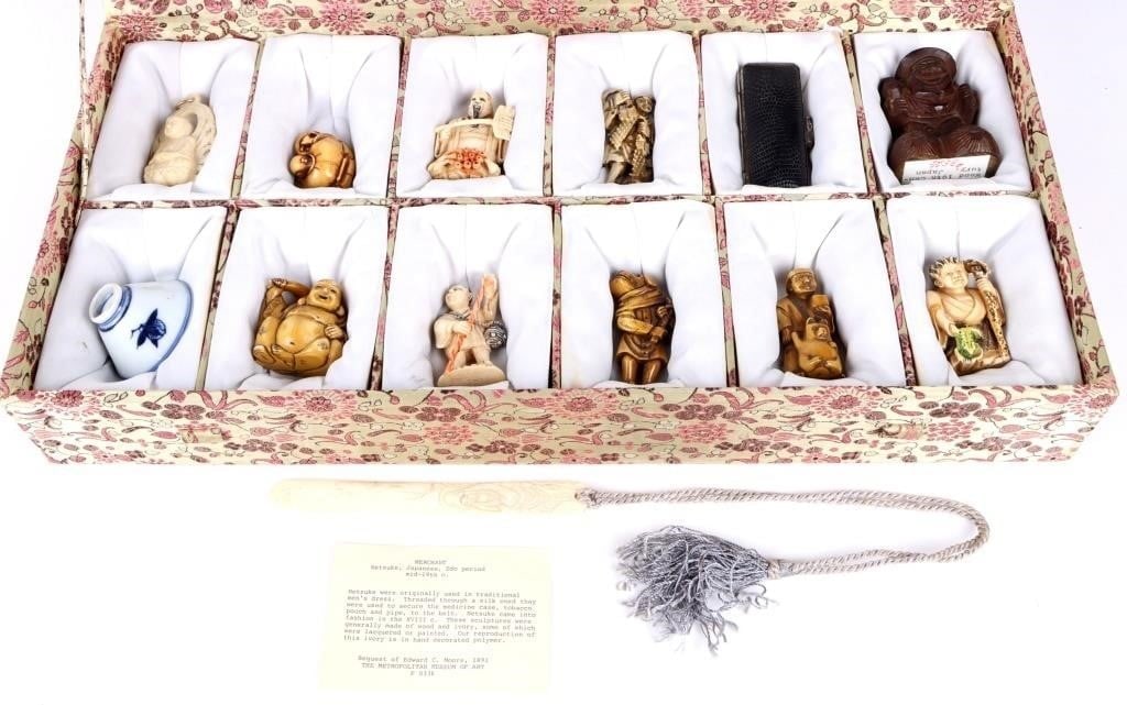 JAPANESE HAND-CARVED NETSUKE COLLECTION & MORE: Japanese hand carved netsuke collection and more to include: nine netsuke figures, one porcelain sake cup, one stamp seal and ink set and one book mark. Comes with a silk case and info sheet. Size: 20