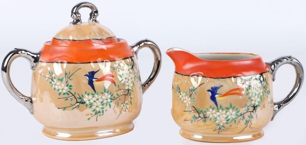 VINTAGE GOLDCASTLE CHIKUSA SUGAR BOWL & CREAMER: Vintage Goldcastle Chikusa sugar bowl and creamer set. Both were made in Japan and feature a peach luster glaze with an orange band and silver luster handles. They are both decorated with hand painted