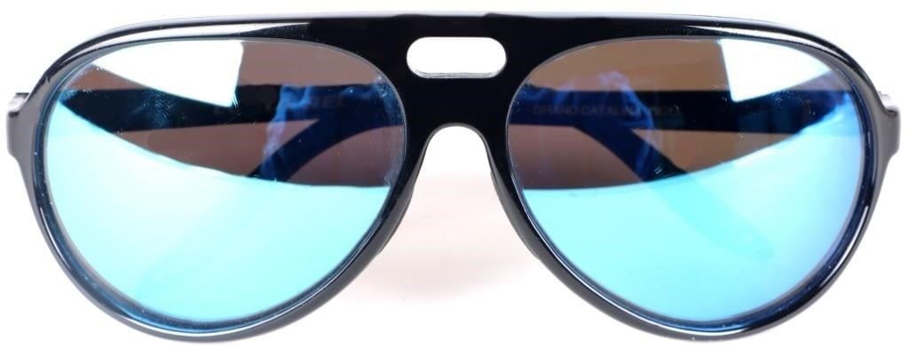 COSTA DEL MAR GRAND CATALINA BLACK SUNGLASSES: Costa Del Mar Grand Catalina sunglasses. The frame is black with translucent blue highlights and the lens are mirror blue/purple. This piece is from a discontinued line. Condition: Like new, see pictu