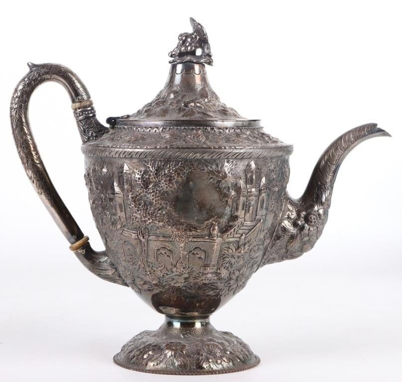 ANTIQUE SILVER-PLATED ORNATE TEAPOT: Antique silver-plated ornate teapot featuring detailed engravings. Size: 11 X 6 X 10" Condition: Very fine. See images.