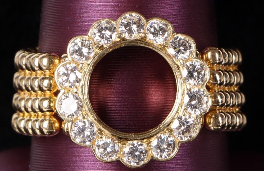 18K YELLOW GOLD LONGINES RING W/ 14 DIAMONDS: 18k yellow gold ladies Longines ring. The face features fourteen brilliant 0.05ct round-cut diamonds arranged in a ring and the band is articulated. The hollow area in the face may accommodate a movem