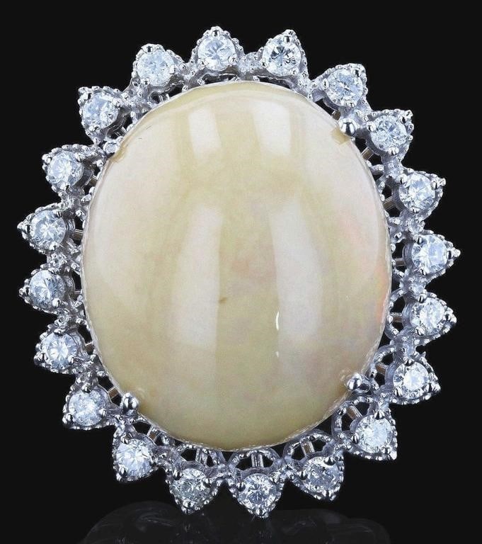 22.17CT OPAL 1.16CTW DIAMOND 14K WHITE GOLD RING: One electronically tested 14KT white gold ladies cast & assembled white opal and diamond ring with a bright polish finish. Featuring a white opal set within a diamond frame, supported by tapering shou