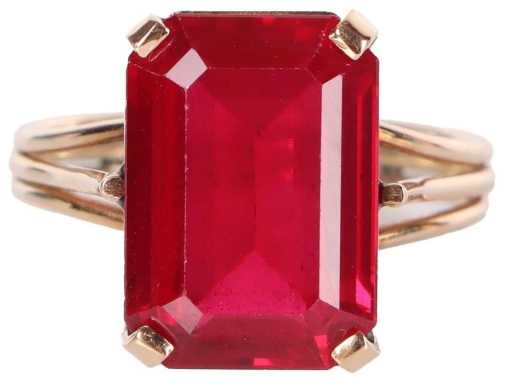 10K YELLOW GOLD RUBY LADIES RING: 10K yellow gold ruby ladies ring. Gemstones to include one 14.10mm X 10.07mm emerald cut ruby. Stone Type: Ruby Weight: 4.86 Grams Size: 8.00 U.S. Condition: Little wear, see images for details.