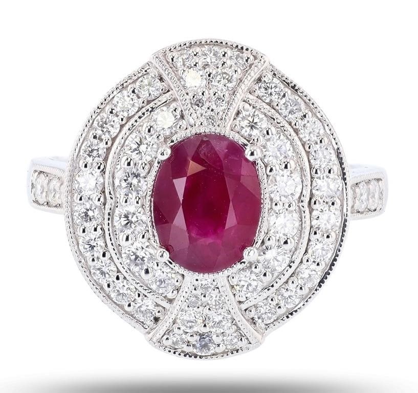 1.28CT BURMESE RUBY PLATINUM LADIES RING W DIA GIA: One polished, stamped, and tested platinum ring marked Oscar Friedman. The ring is mounted with: 1 genuine GIA certified Burmese. Ruby cent stone weighing 1.28 carts, and 56 genuine round diamonds