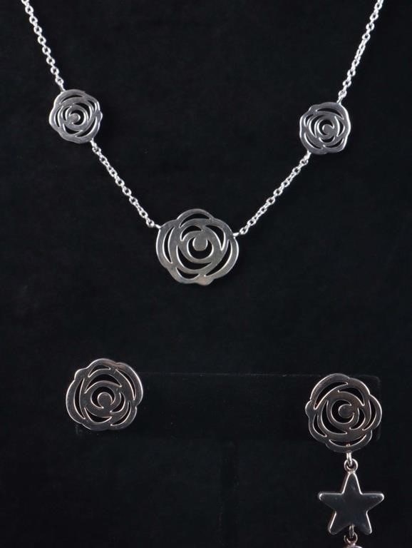 TOUS DESIGNER STERLING SILVER LADIES JEWELRY: Tous designer sterling silver ladies jewelry to include: one necklace with roses and one pair of matching asymmetrical earrings with a classic Tous design. Weight: 17.08 Grams Size: 16" Length Conditi