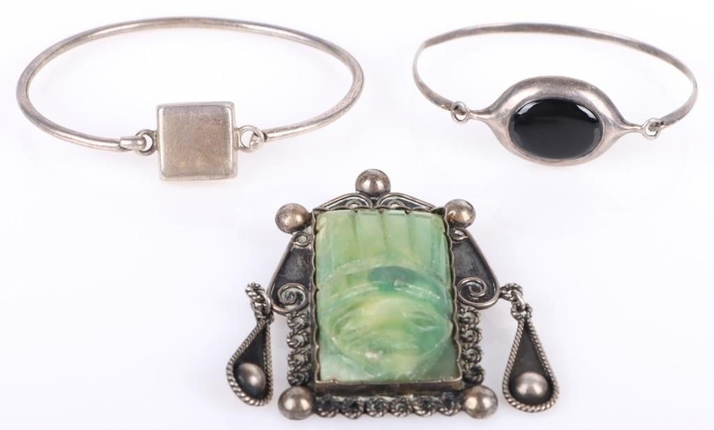 MEXICAN STERLING SILVER TRADITIONAL JEWELRY: Mexican sterling silver traditional jewelry to include: one green carved stone ladies brooch, one black onyx bracelet, and one solid sterling bracelet. Stone Type: Assorted Weight: 62.13 Grams Size: 2