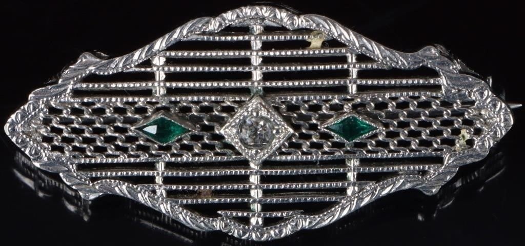 ANTIQUE FILIGREE 10K WHITE GOLD CZ LADIES PIN: Antique filigree ornate 10k white gold cubic zirconium ladies pin. Green and white cubic zirconium. Stone Type: CZ Weight: 2.93 grams Size: 1.5" length Condition: Some wear, see images.