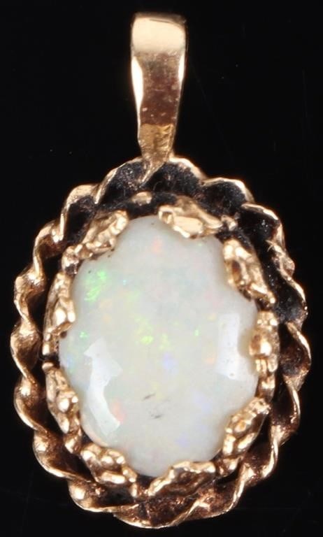 VINTAGE OPAL 14K YELLOW GOLD LADIES PENDANT: Vintage opal 14K yellow gold ladies pendant. Stone Type: Opal Size: 0.5" length Condition: Wear commensurate with age. See images for complete condition.