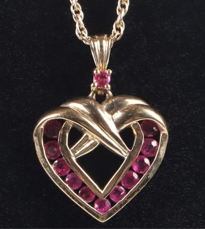 0.36CTW RUBY HEART LADIES PENDANT NECKLACE: 0.36CTW ruby heart ladies pendant necklace. The necklace and pendant are gold plated over sterling silver. Stone Type: Ruby Weight: 4.89 GRAMS Size: 18.5" Condition: Very fine.