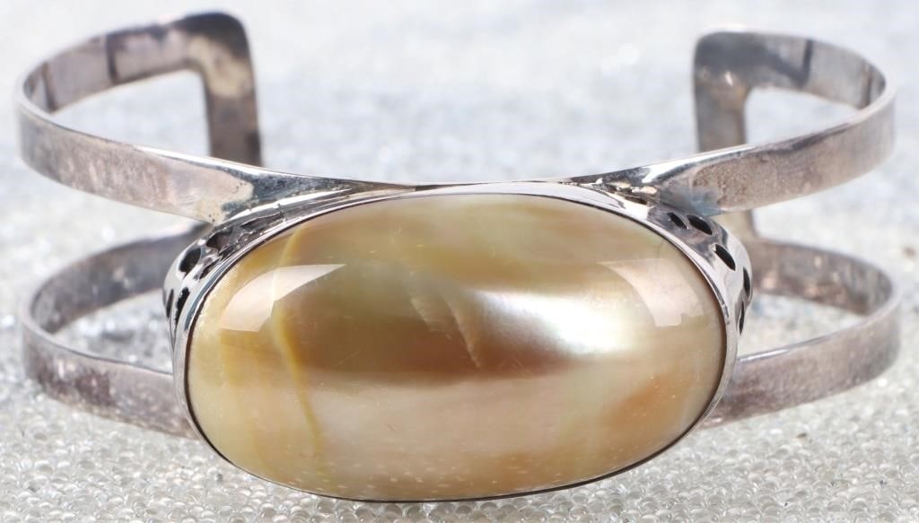 MOP LOMBOK INDONESIA STERLING SILVER BRACELET: Sterling silver ladies bracelet with a ~1.5 X 1" mother of pearl on the face, manufactured by Lia Pearl & Jewelry in Lombok, Indonesia. includes certificate of authenticity. Stone Type: Mother of Pear