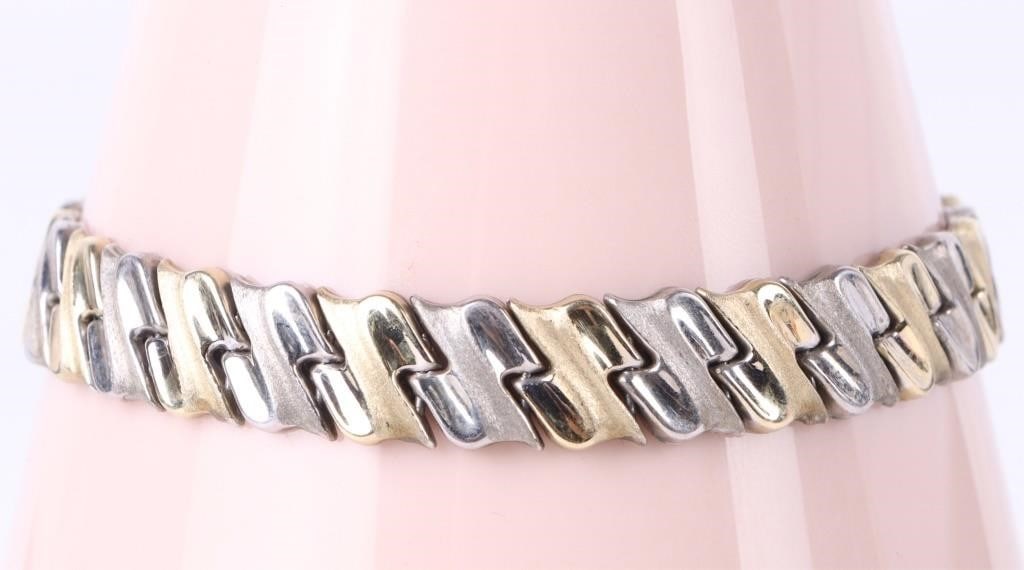 GOLD PLATE & STERLING SILVER LADIES BRACELET: Gold plate and sterling silver ladies bracelet with 1/15 14K gold plated links. Weight: 10.81 Grams Size: 7.5" length Condition: Gently worn. See images for complete condition.
