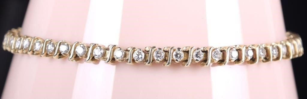 14K YELLOW GOLD DIAMOND LADIES TENNIS BRACELET: 14K yellow gold diamond ladies tennis bracelet. Gemstones to include fifty 0.03ct round cut diamonds. Stone Type: Diamond Weight: 8.04 Grams Size: 7.50" Condition: Some wear, see images for details.