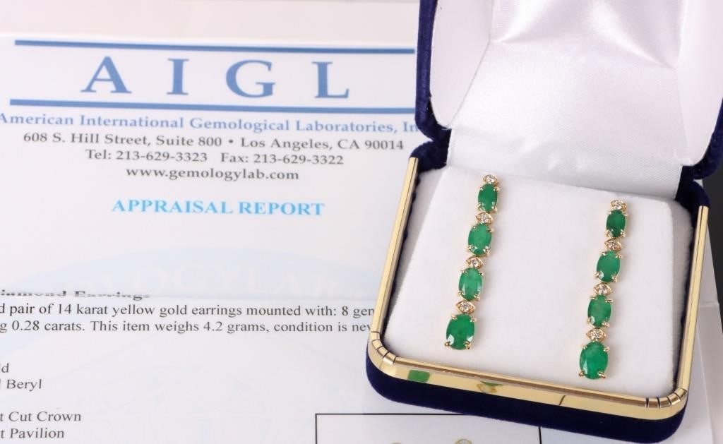 5.81CTW EMERALD 14K YELLOW GOLD LADIES EARRINGS: Pair of 14k yellow gold ladies dangle earrings. Each piece features four links and each link features an oval-cut emerald gemstone (6 x 4 - 8 x 6mm, 5.81ctw). Each emerald features a brilliant small r