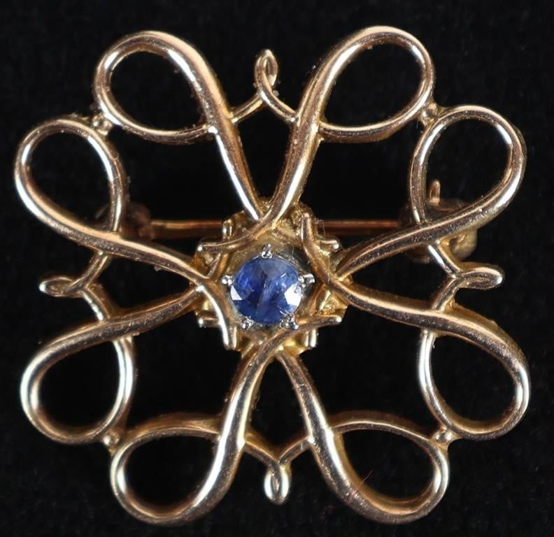 10K YELLOW GOLD LADIES BROOCH W/ TOPAZ GEMSTONE: 10k yellow gold ladies brooch with a 0.07ct round-cut topaz center gemstone. Stone Type: Topaz Weight: 2 grams Size: 19.35 x 19.35mm Condition: See pictures.