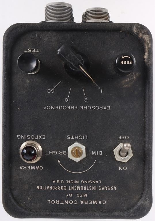 CAMERA CONTROL UNIT ABRAMS INSTRUMENT CORPORATION: Camera control unit for use by the US Air Force. This would control cameras for bombardment. The front possesses four amphenol-style plugs and the top possesses a removable fuse. The piece is