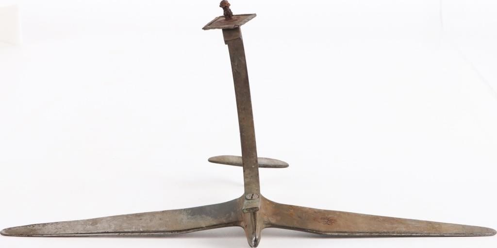 VINTAGE WWII TRENCH ART BRASS SPITFIRE PLANE: Vintage WWII trench art piece of a brass spitfire plane with stylistically elongated wingtips, perhaps to emulate a bird. The piece lacks a base though there is a screw and plate which could easily